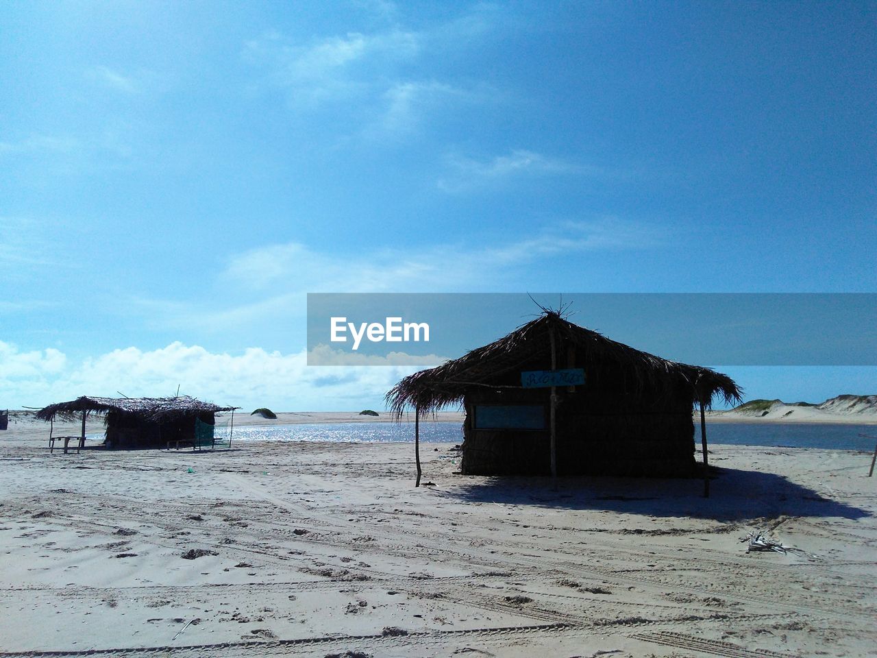HOUSE ON BEACH AGAINST SKY