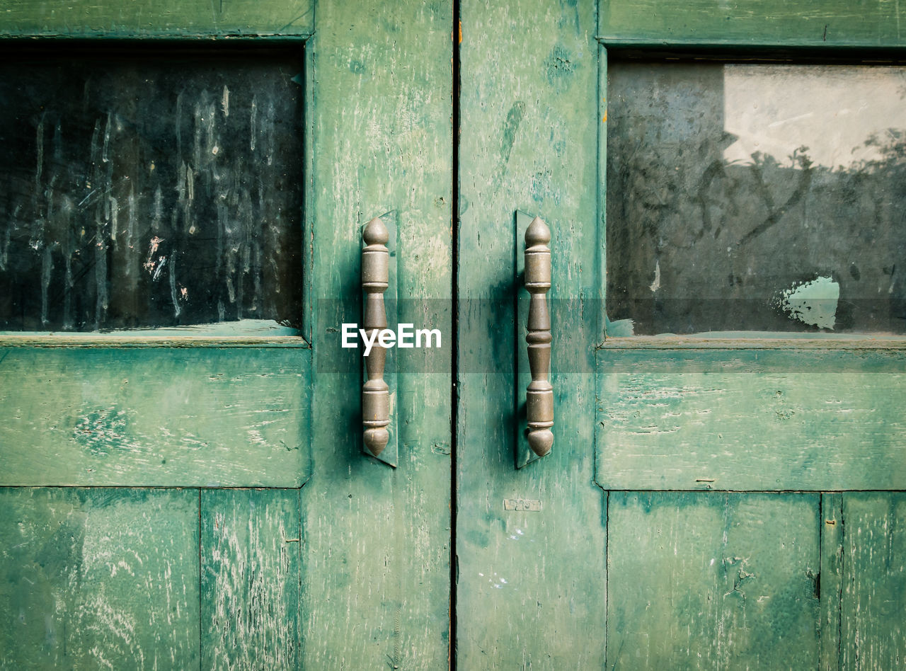 Close-up of old wooden door of building