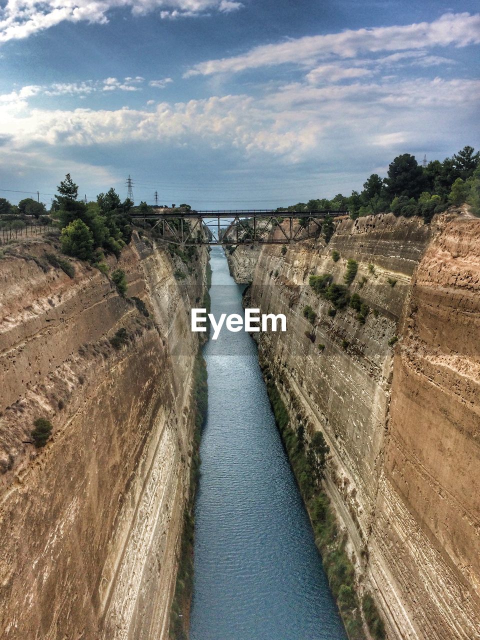 Scenic view of river amidst trees against sky