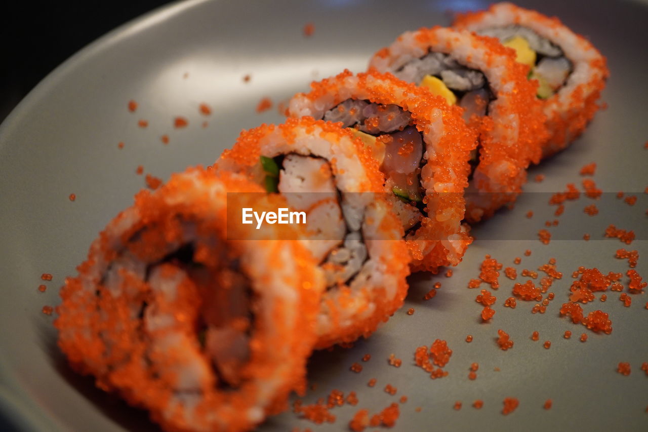 CLOSE-UP OF SUSHI SERVED ON PLATE