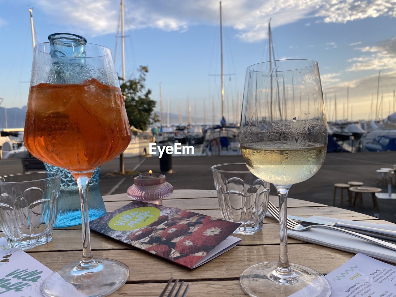 glass, drink, food and drink, refreshment, alcohol, wine glass, table, drinking glass, wine, sky, restaurant, household equipment, nature, no people, water, cloud, business, food, vacation, outdoors, day, travel, alcoholic beverage, trip, summer, white wine, holiday, champagne stemware