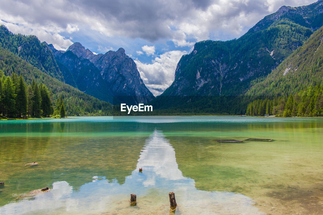 Scenic view of lake and mountains against sky