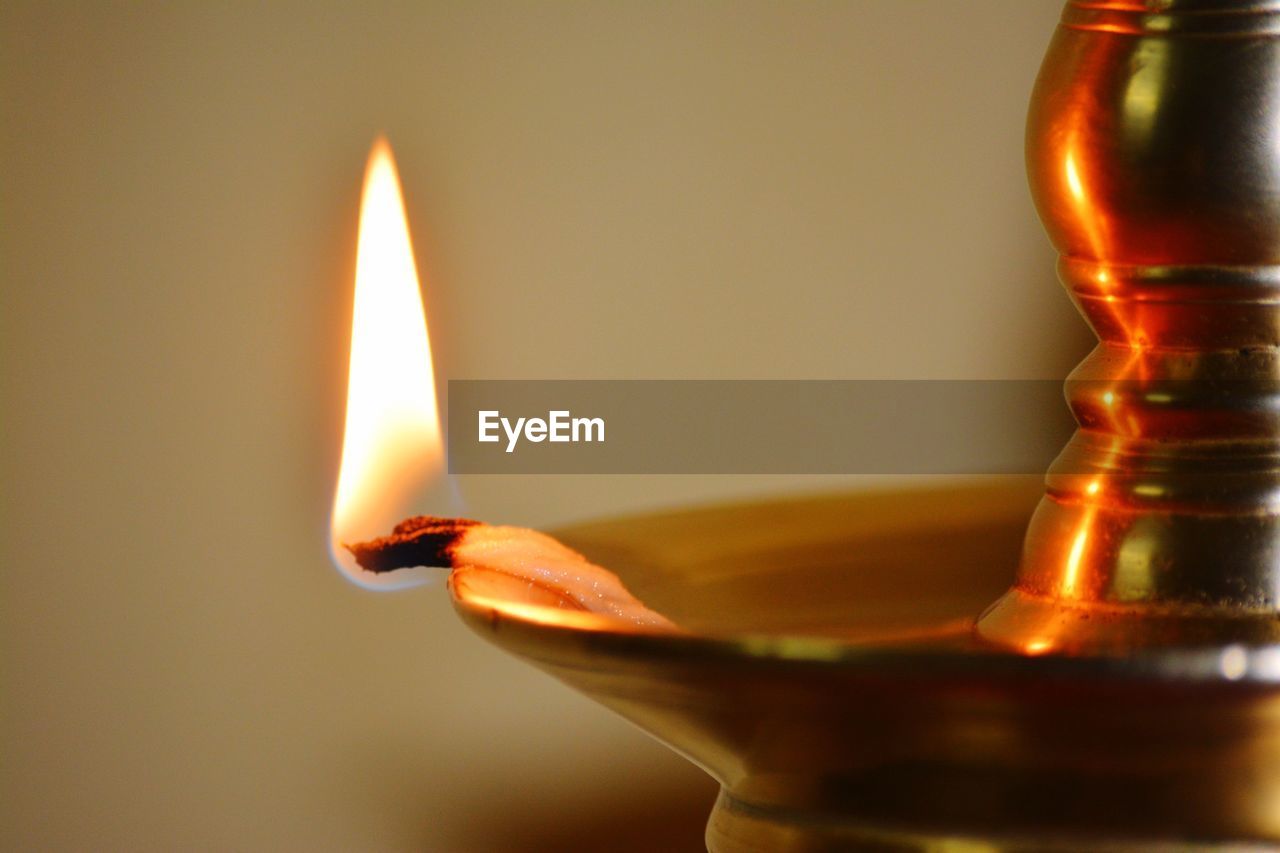 Close-up of illuminated diya