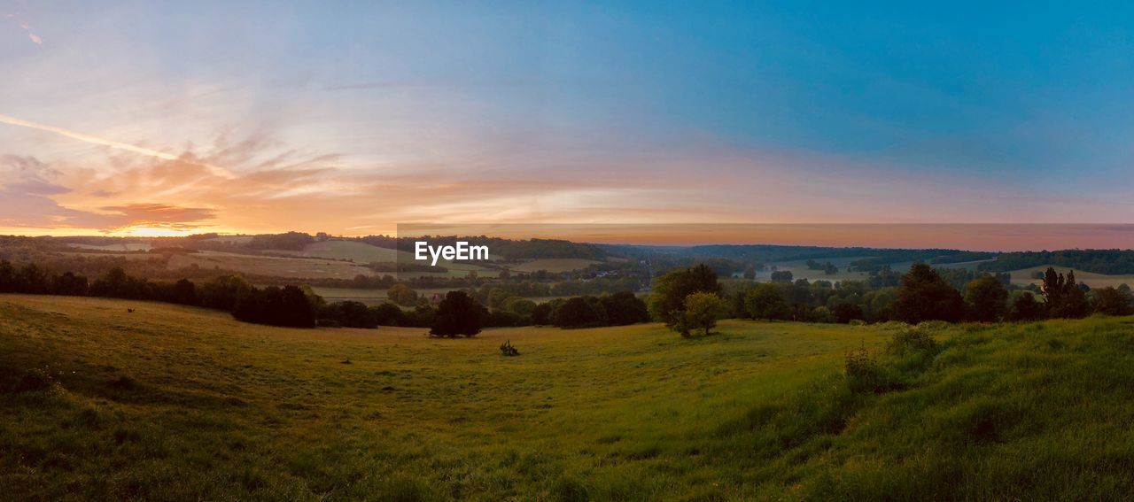 Scenic view of landscape against sky during sunset