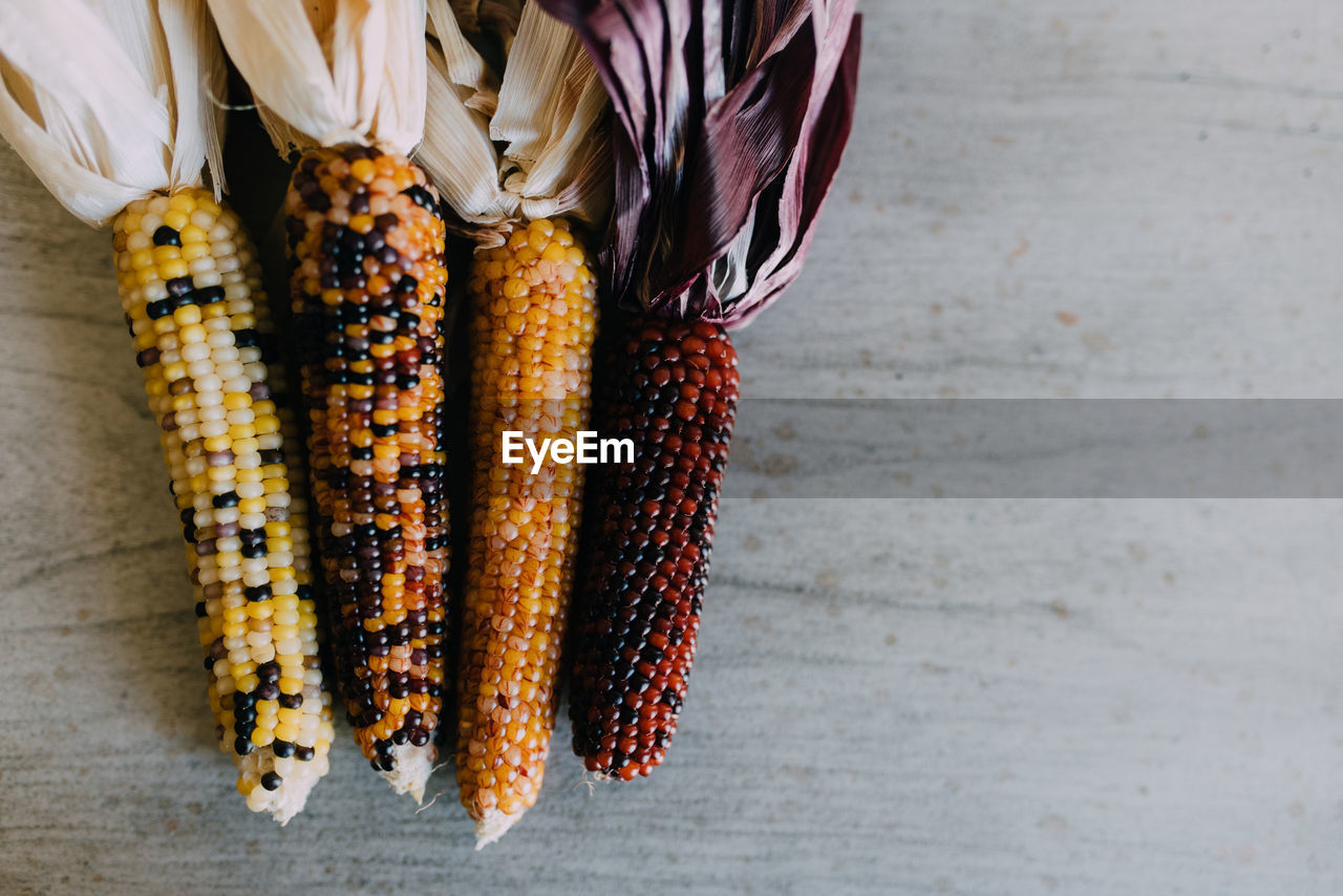 Close-up of various corns on the table