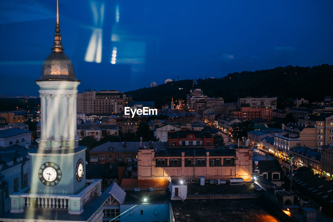 Illuminated buildings in city at night