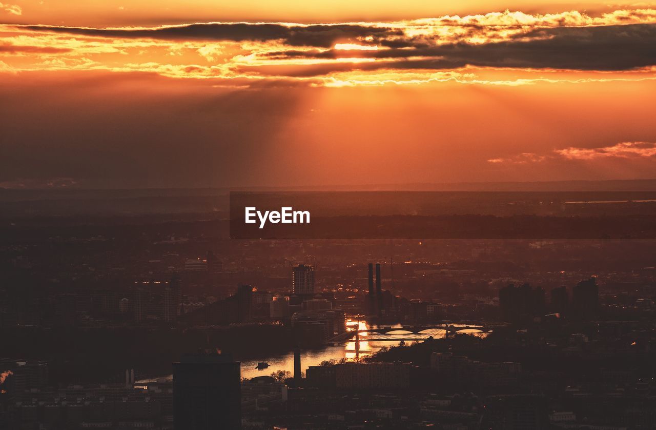 Aerial view of city during sunset