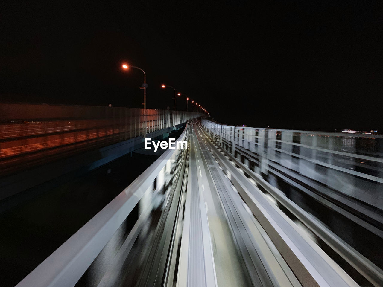 Light trails on road at dark night.
