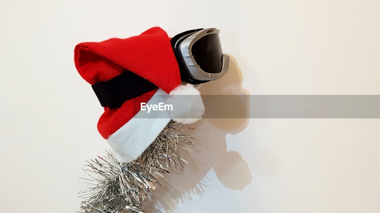 CLOSE-UP OF CHRISTMAS DECORATION AGAINST WHITE BACKGROUND