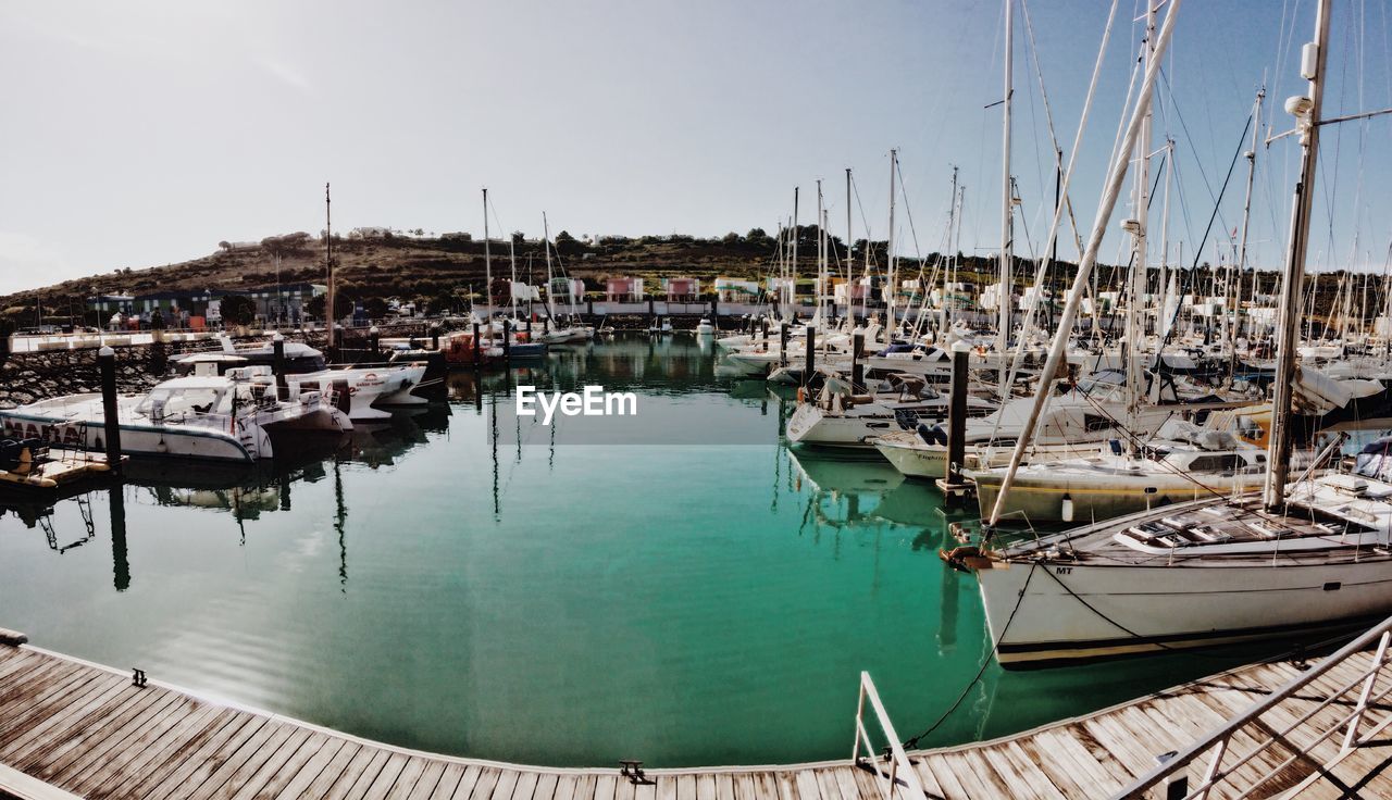 Boats moored in harbor