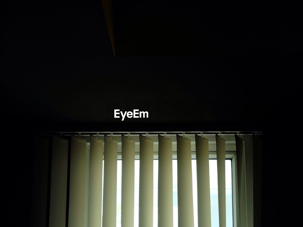 Blinds on window in room