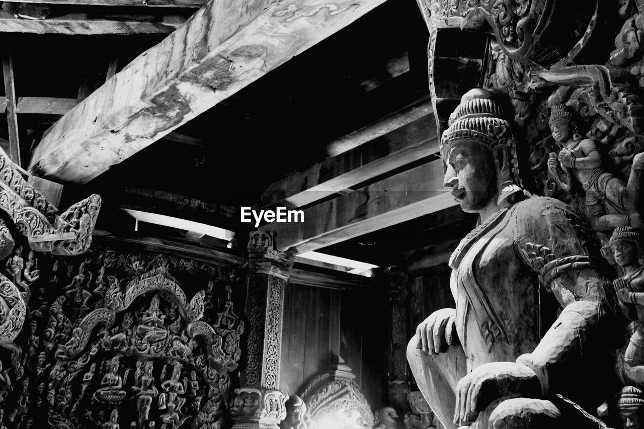 LOW ANGLE VIEW OF STATUE AT TEMPLE