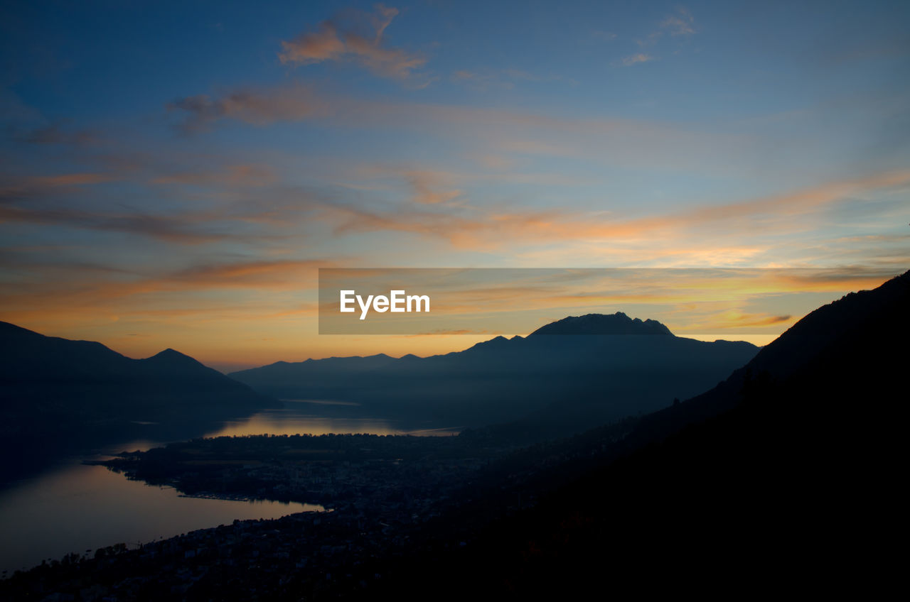 Scenic view of mountain range against sky during sunset
