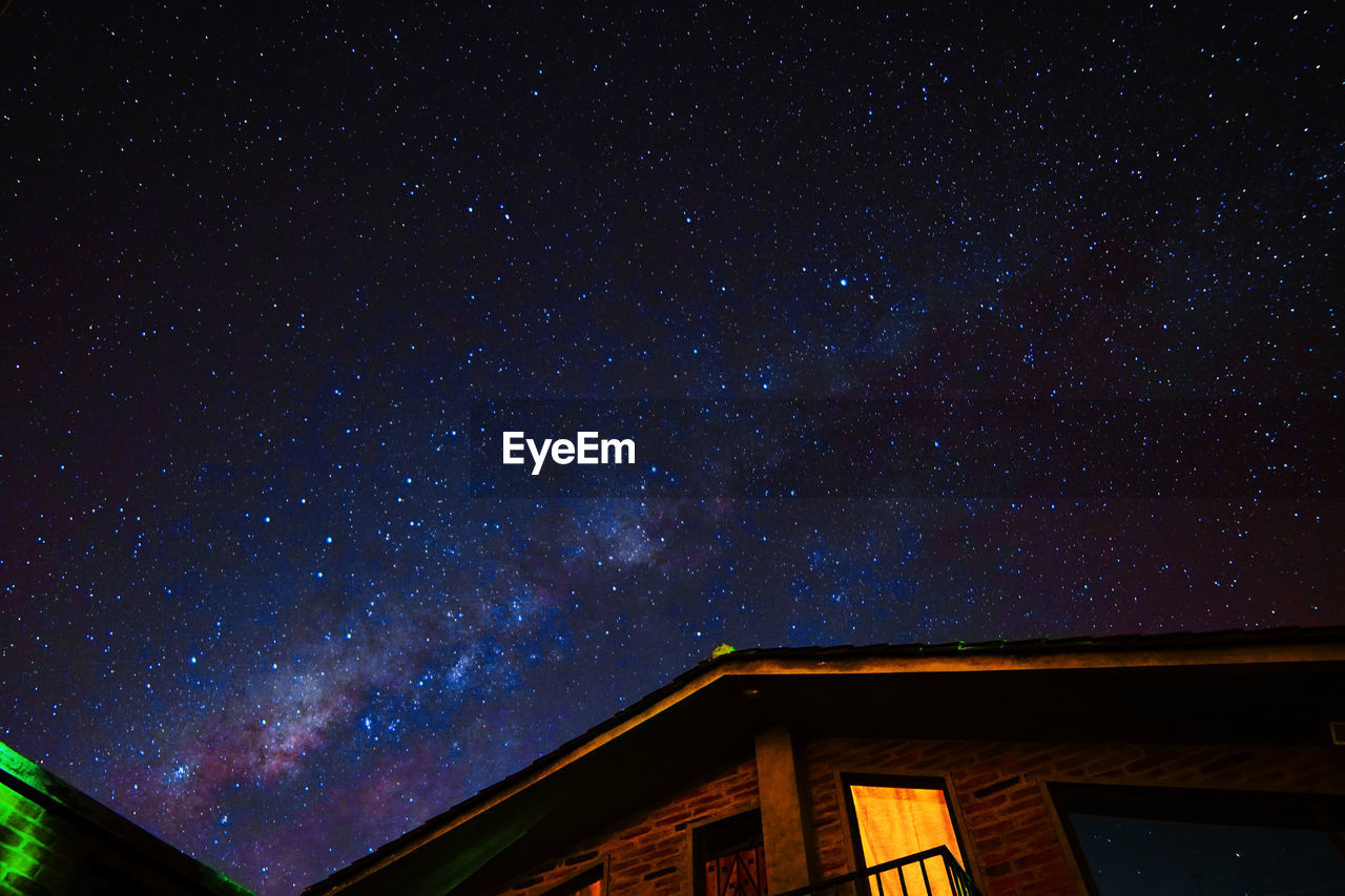 Low angle view of star field against sky at night