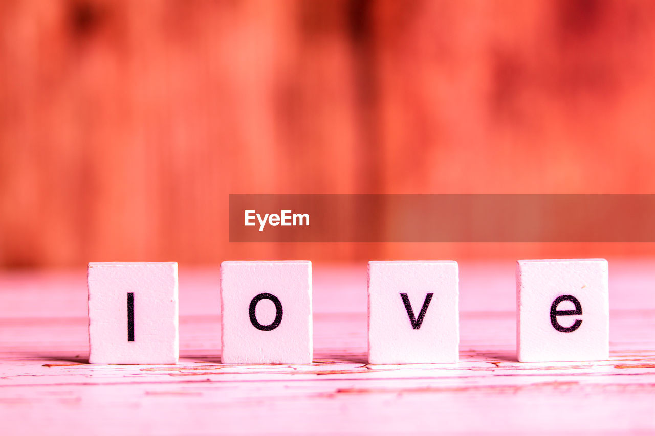 Close-up of love text with blocks on table