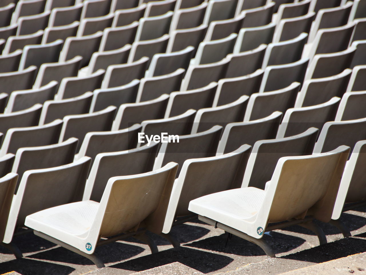 High angle view of empty chairs in stadium