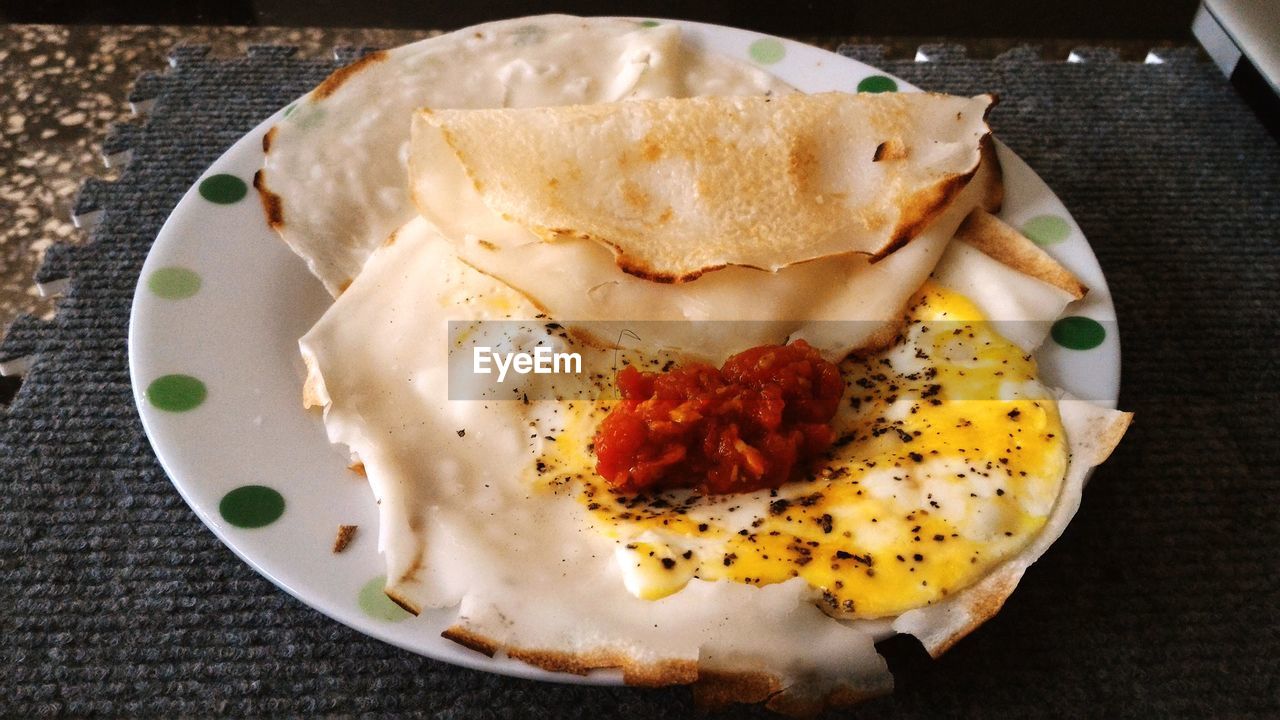 CLOSE-UP OF SERVED FOOD ON TABLE