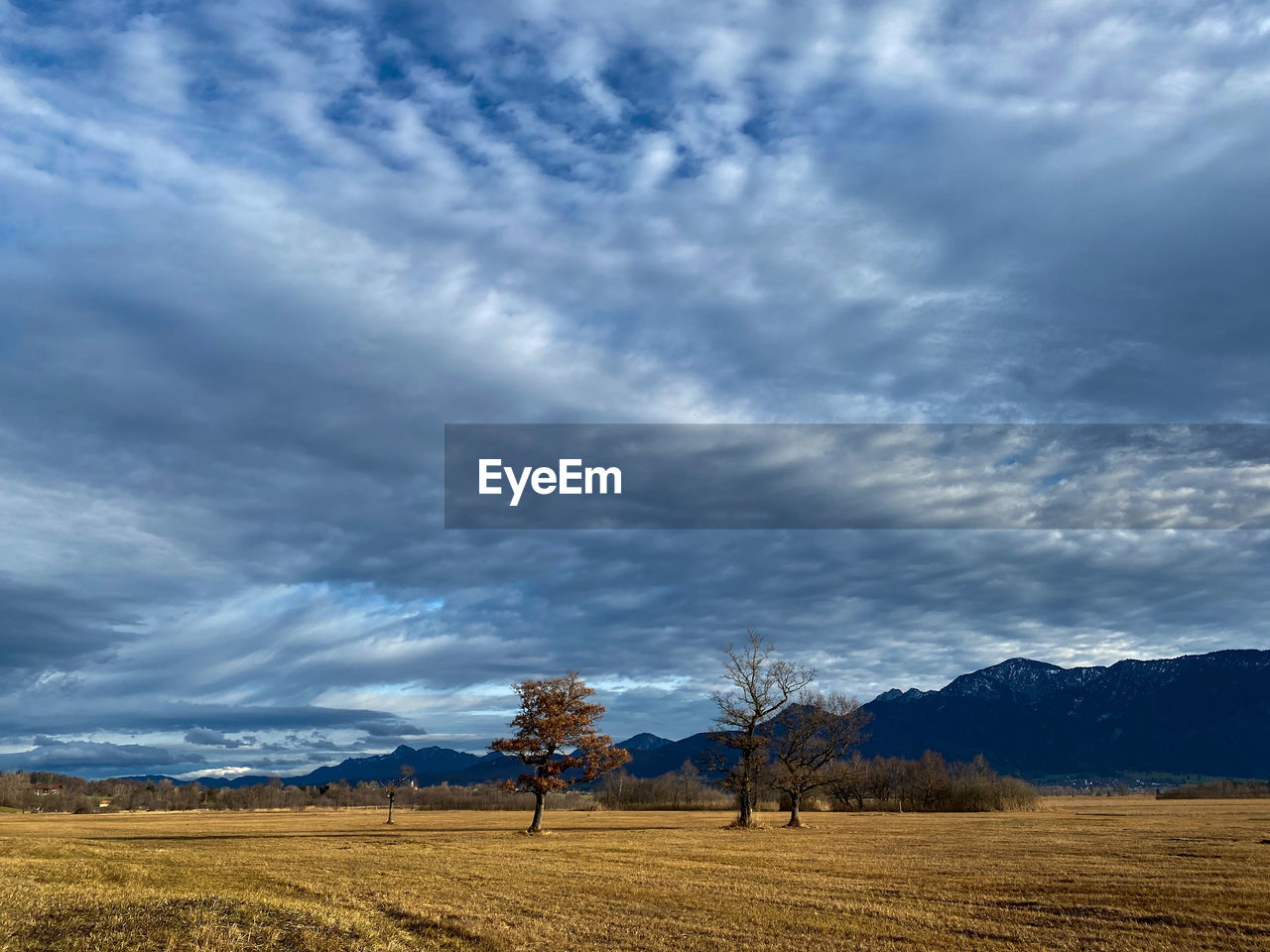 Scenic view of field against cloudy and stormy sky at murnauer moos, upper bavaria 
