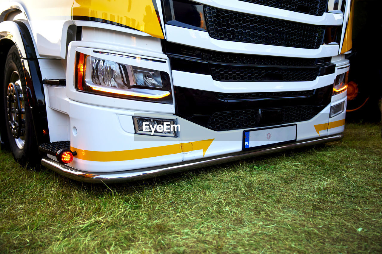 Truck, tuned with white and yellow coloring.