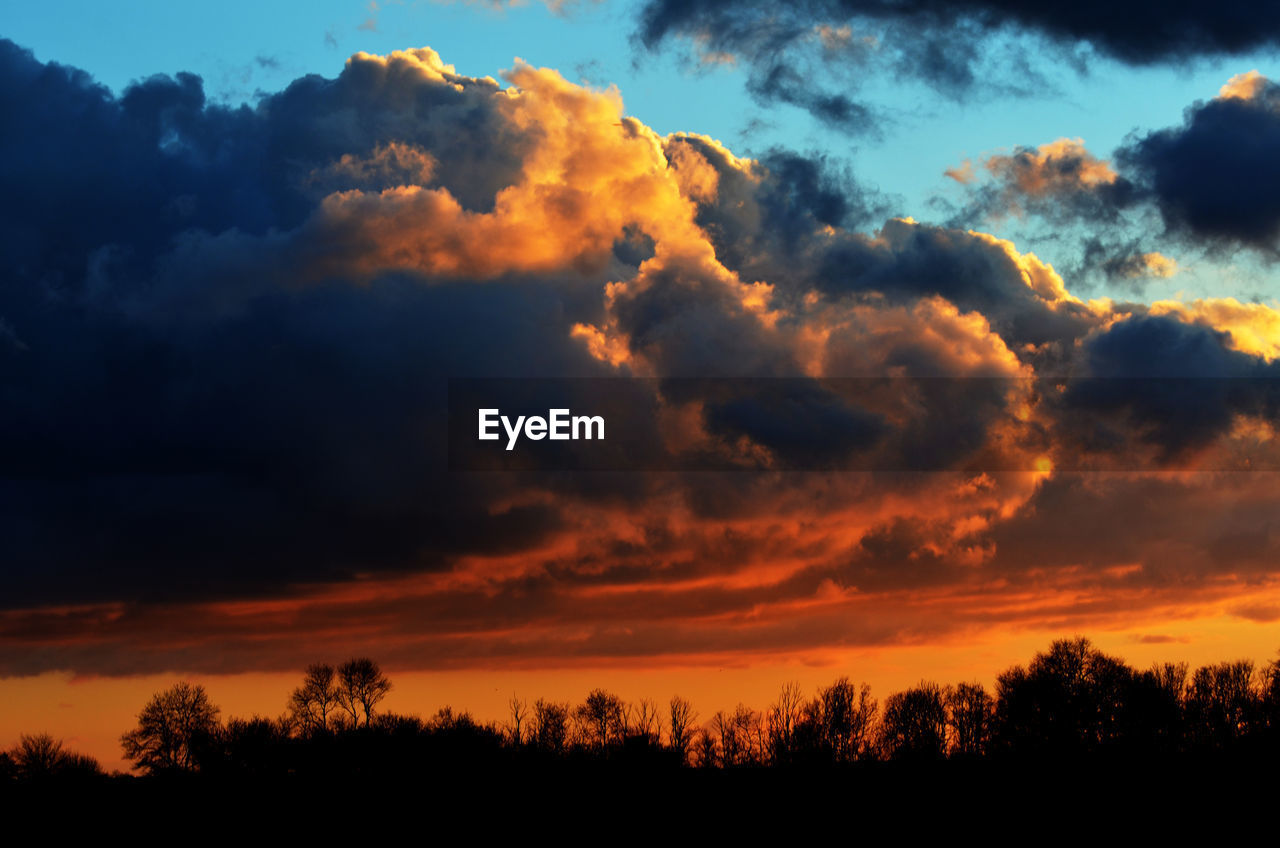 Low angle view of cloudy sky at sunset