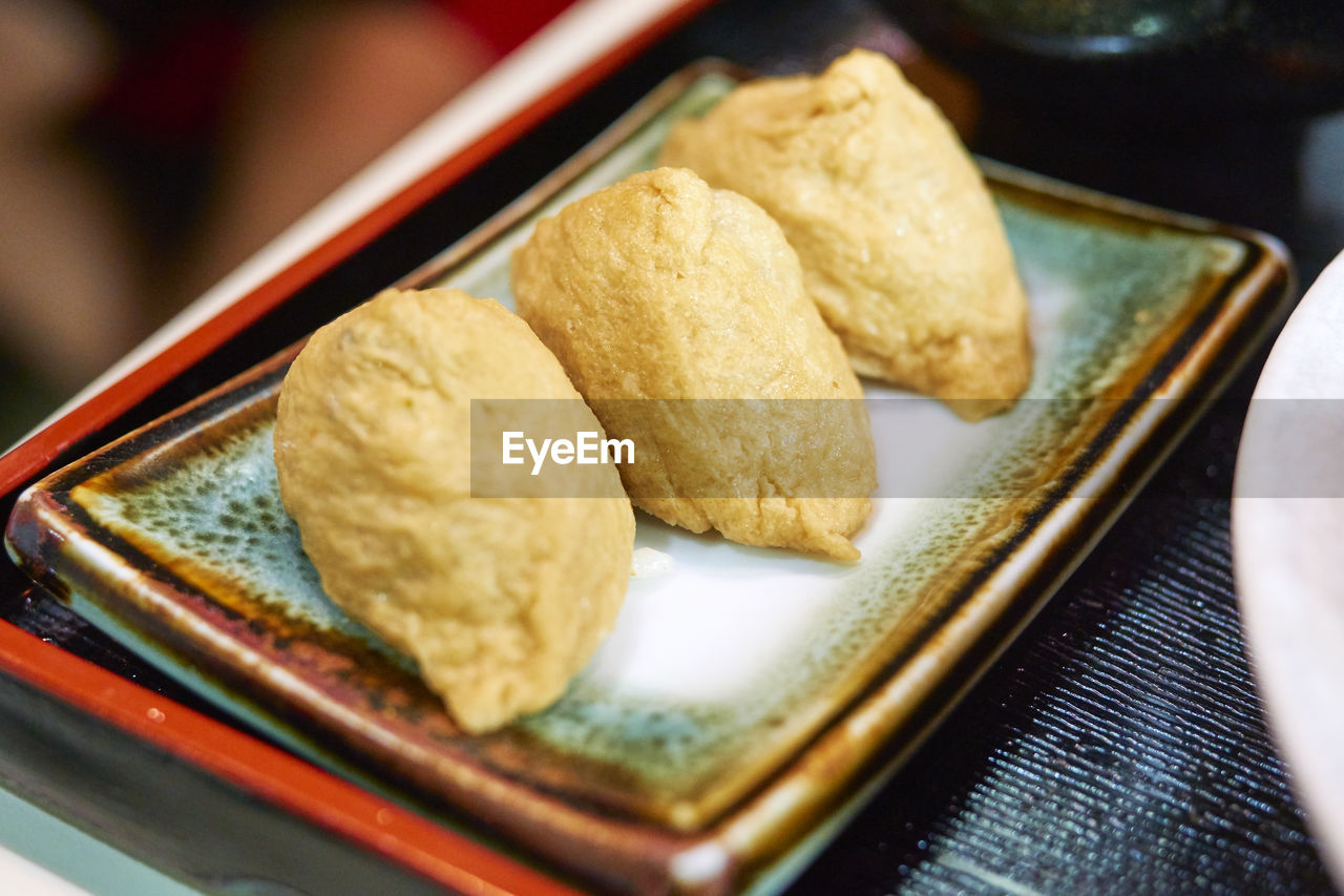 Close-up of fried dumplings on plate