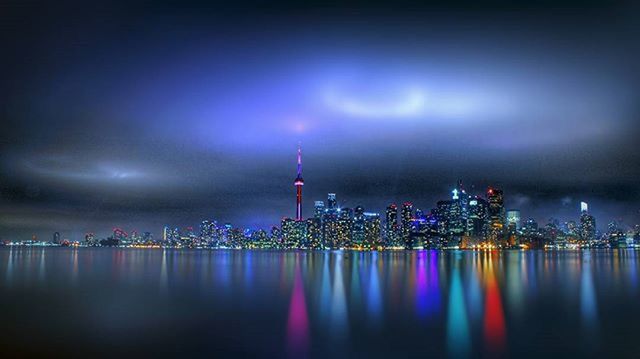 ILLUMINATED CITYSCAPE AT NIGHT