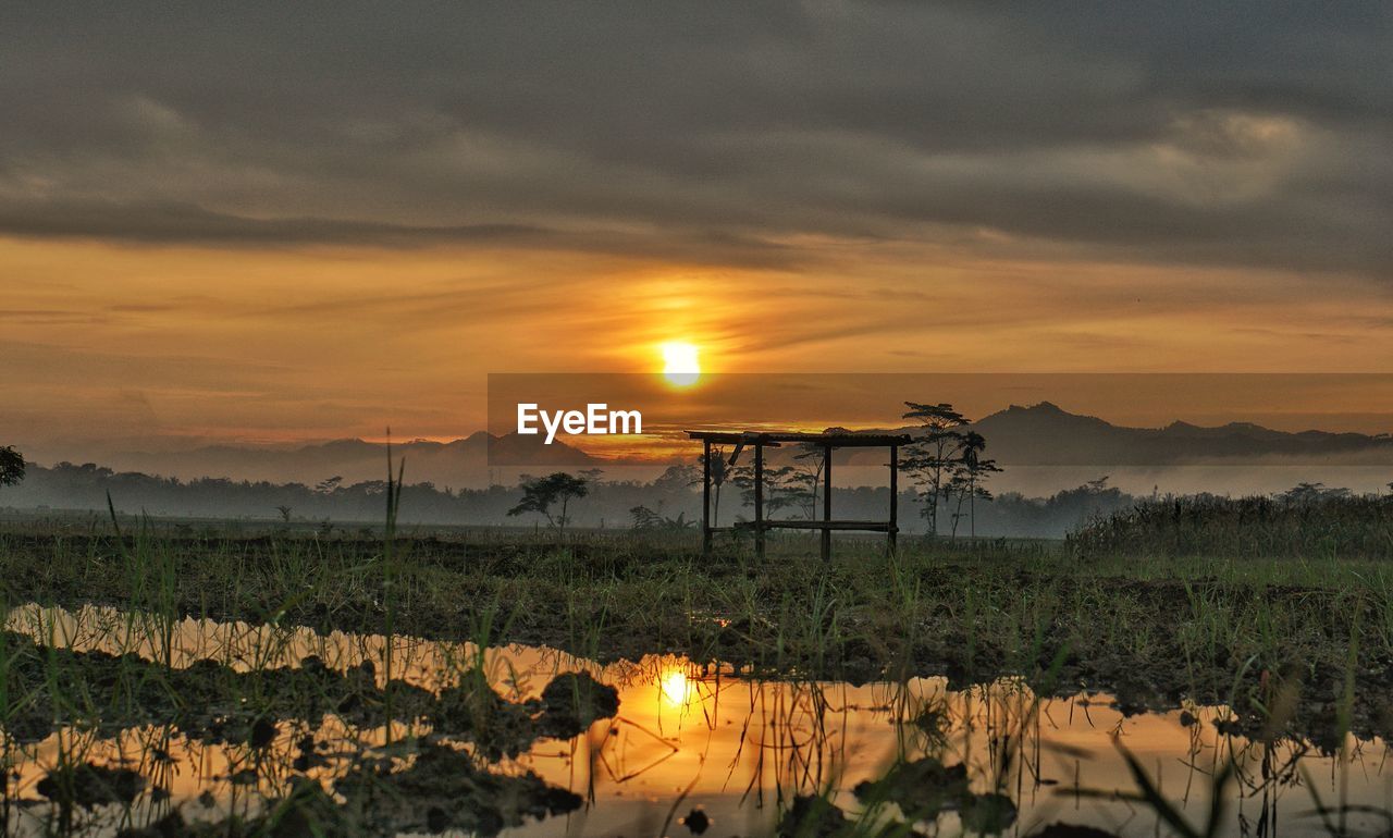 Sunrise over rice fields and mountains