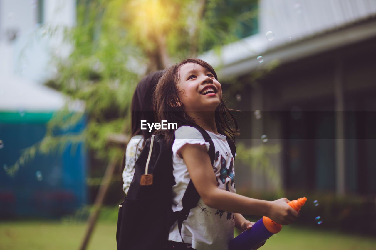 SMILING GIRL LOOKING AT CAMERA