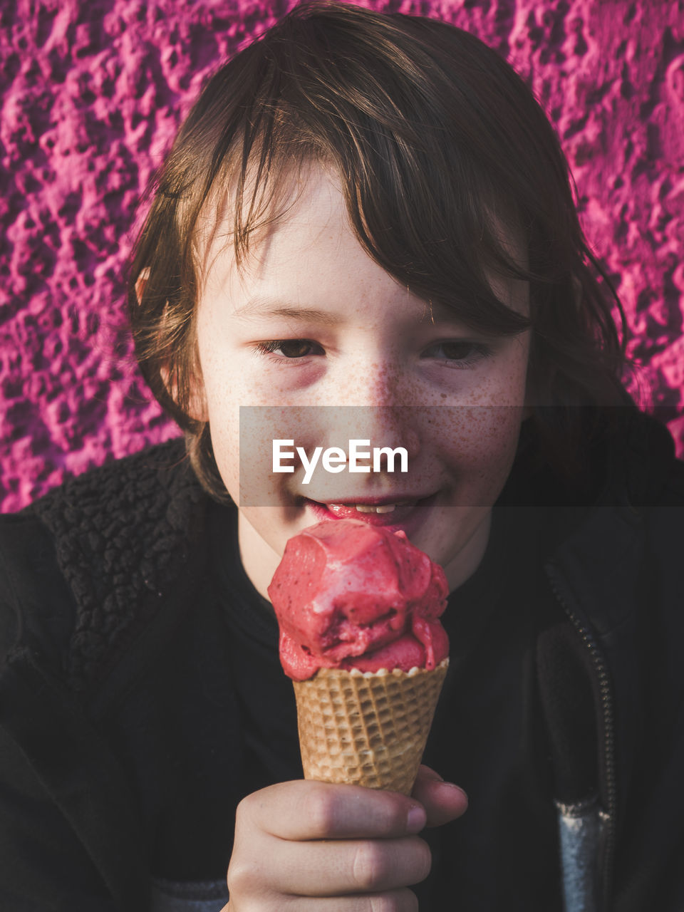 Close-up portrait of boy eating ice cream