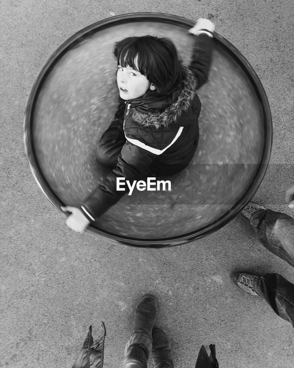 Low section of child on a spinning plate