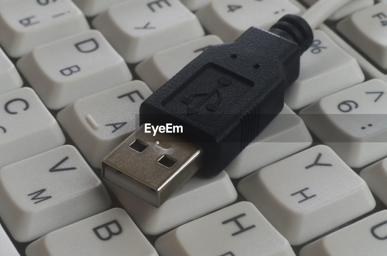 High angle view of usb cable on computer keyboard