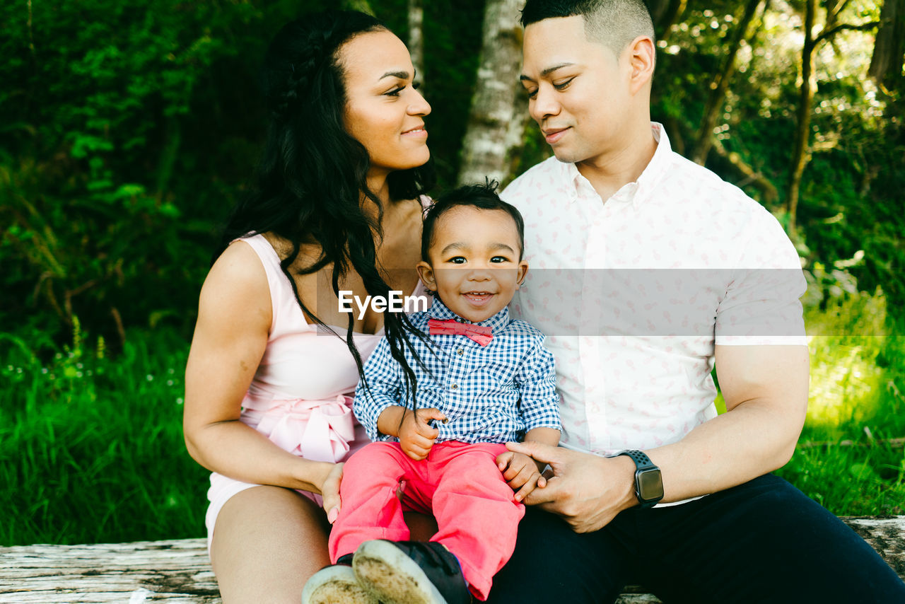 Closeup cropped family portrait of two parents and their baby boy