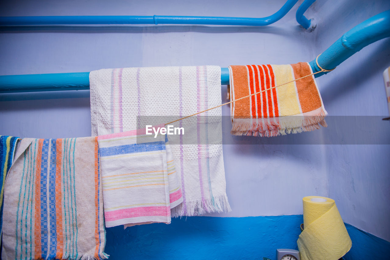 Close-up of towels drying on clothesline