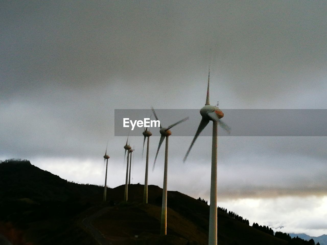 LOW ANGLE VIEW OF WIND TURBINE AGAINST SKY