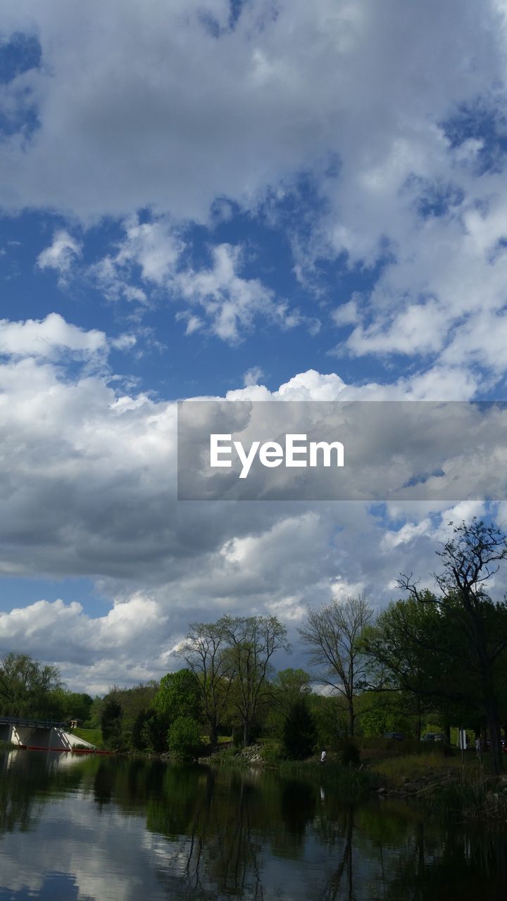 VIEW OF LAKE AGAINST CLOUDY SKY