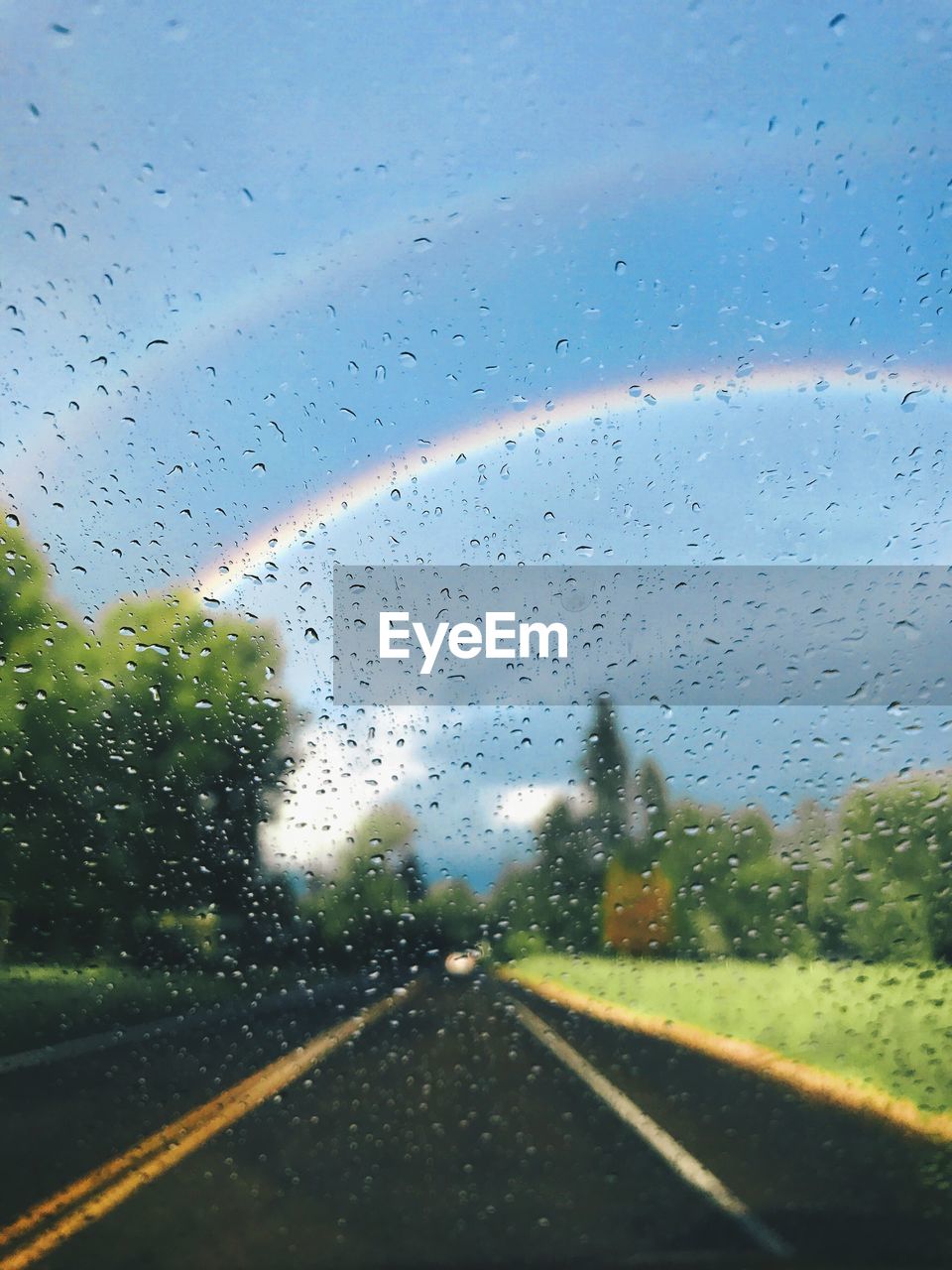 RAINDROPS ON GLASS WINDOW OF RAIN