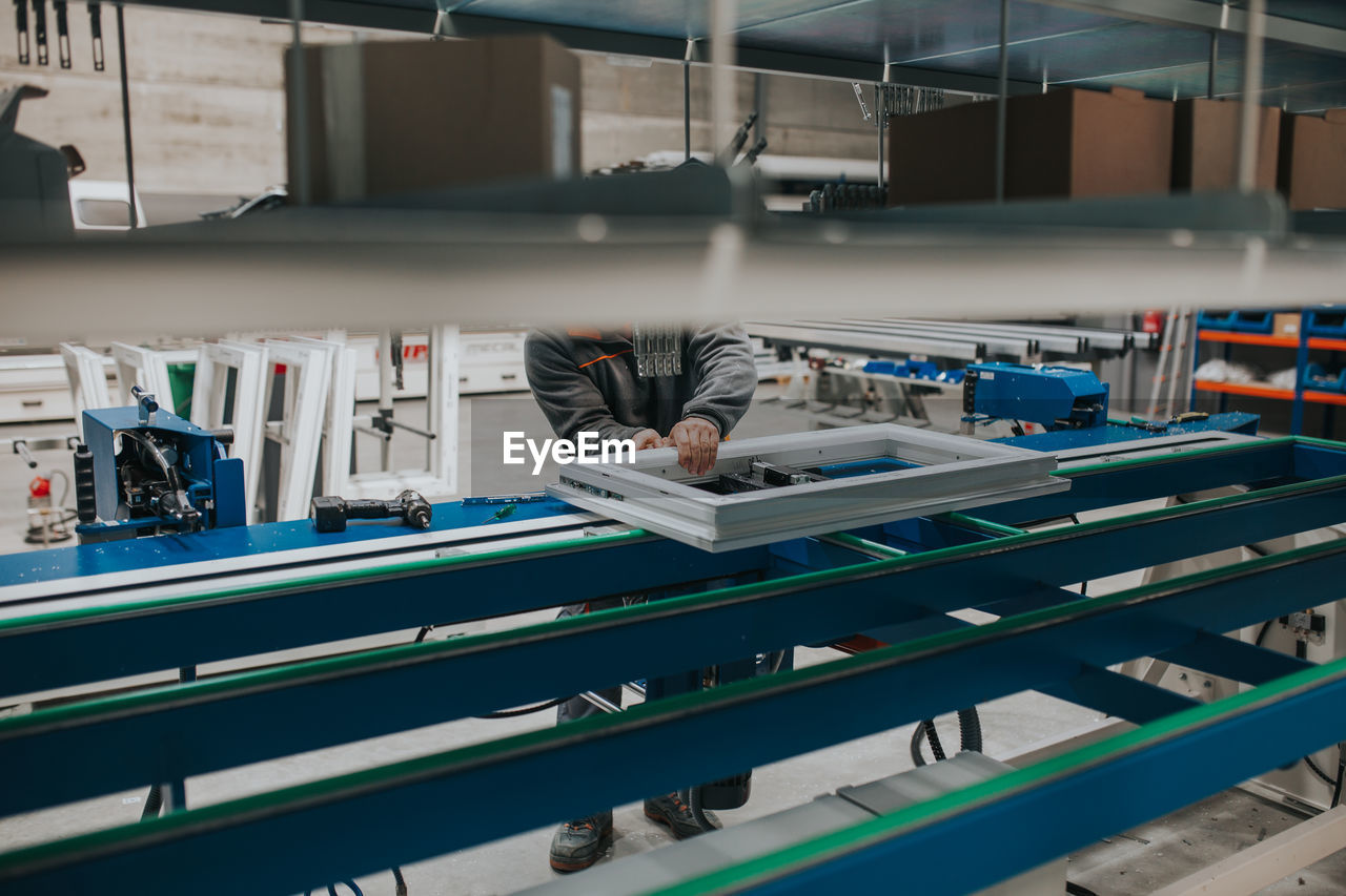 Low section of man working in factory