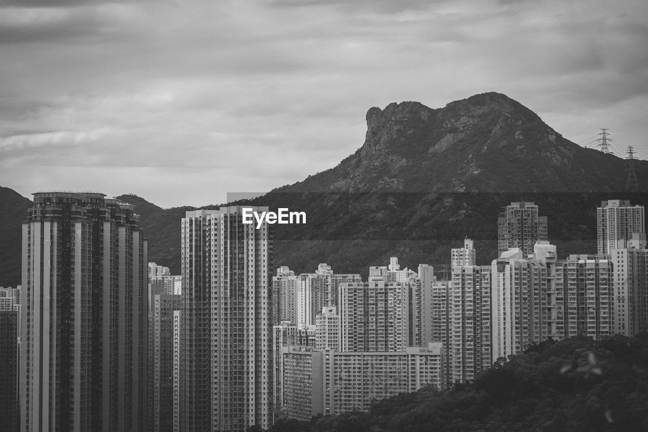 Buildings in city against sky