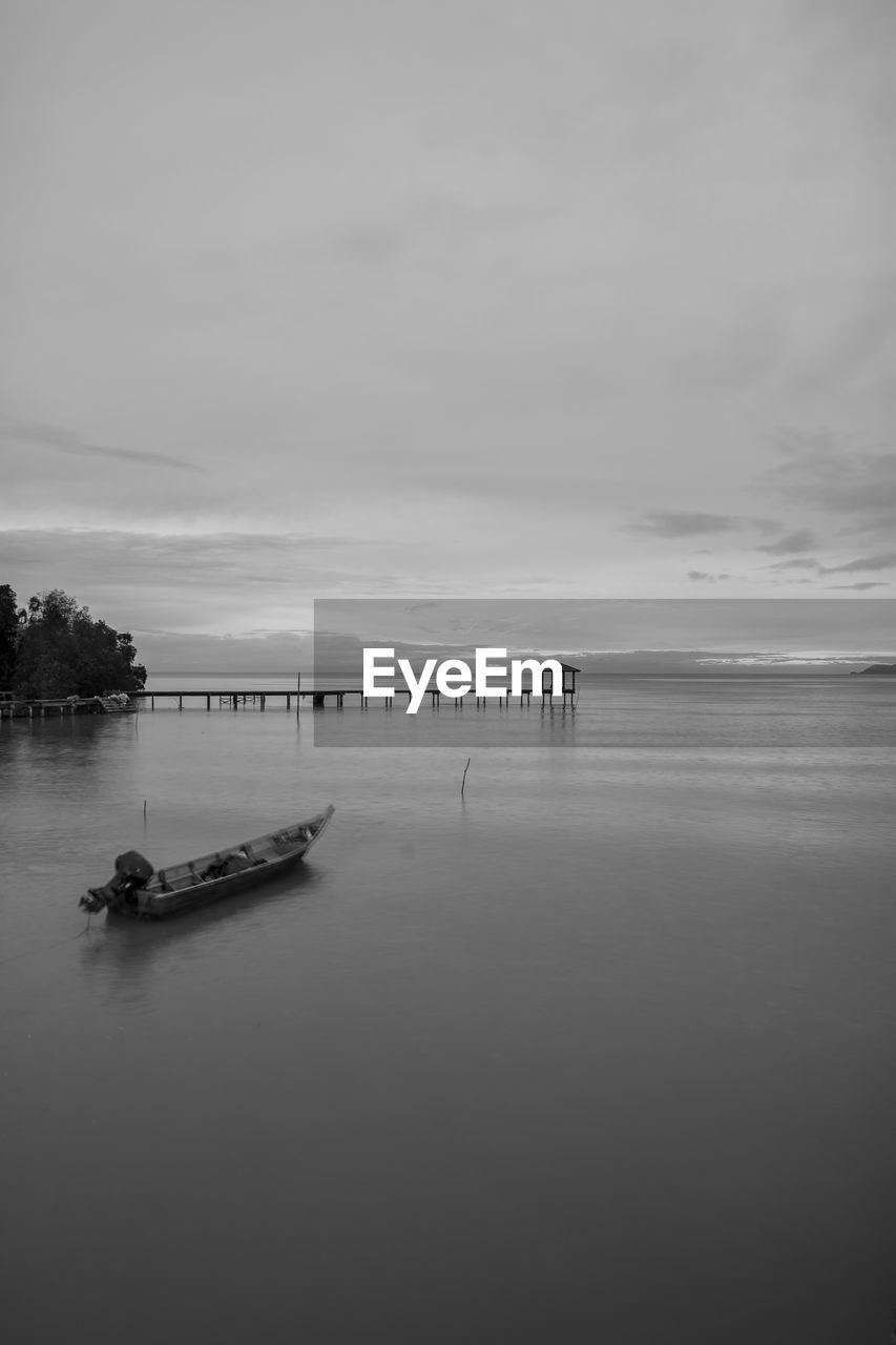 View of pier on calm lake