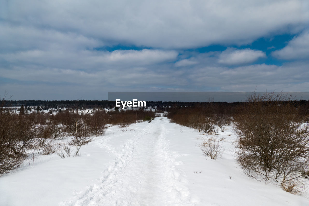 SCENIC VIEW OF SNOW COVERED LAND