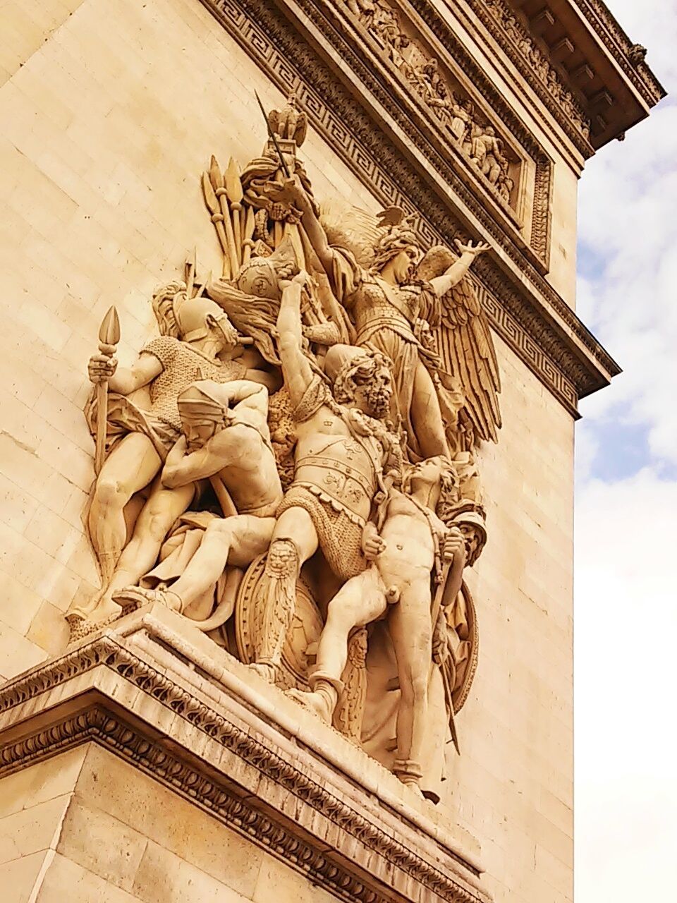 Low angle view of statues on arc de triomphe