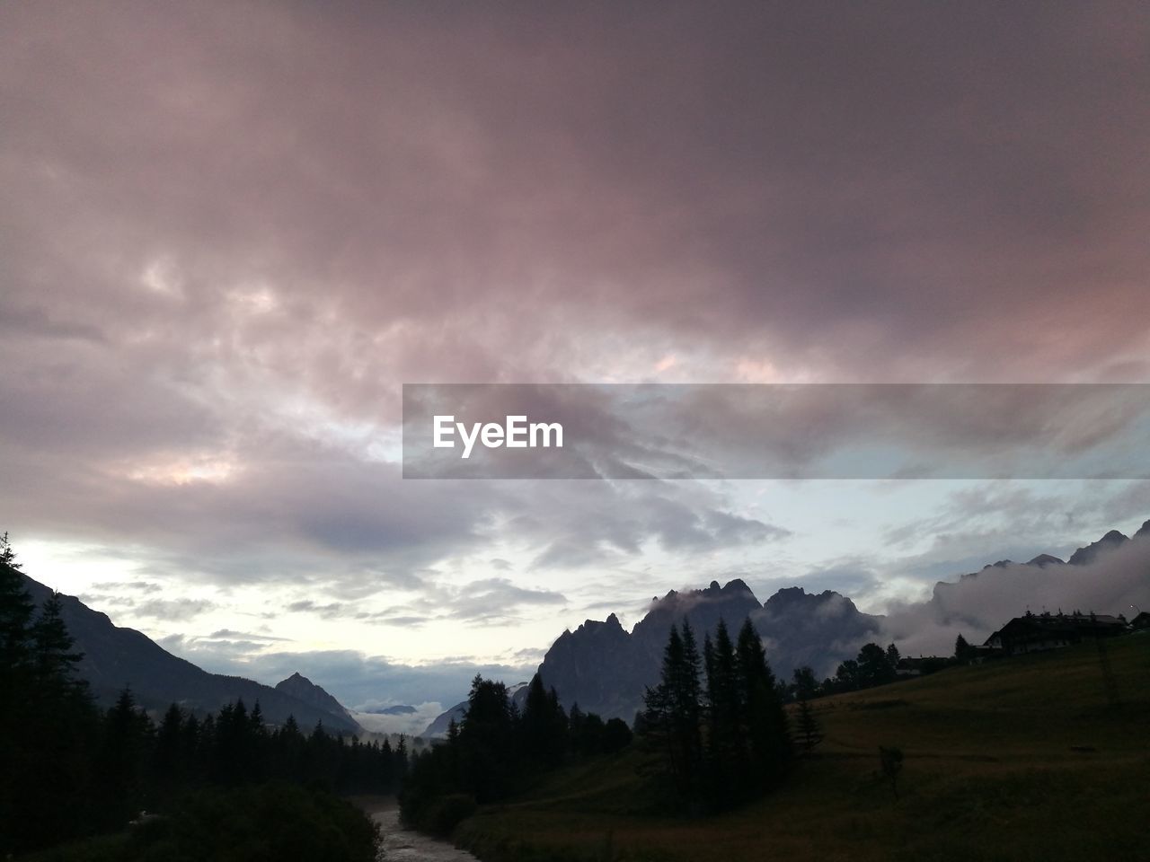 SCENIC VIEW OF LANDSCAPE AND MOUNTAINS AGAINST SKY