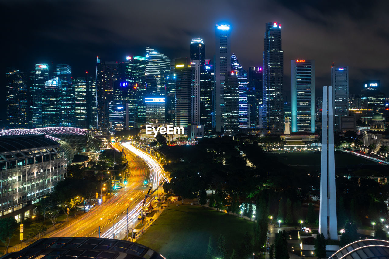 High angle view of illuminated city buildings at night