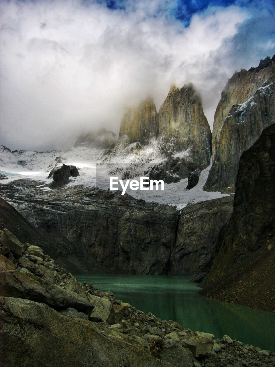 Scenic view of rocks in sea against sky