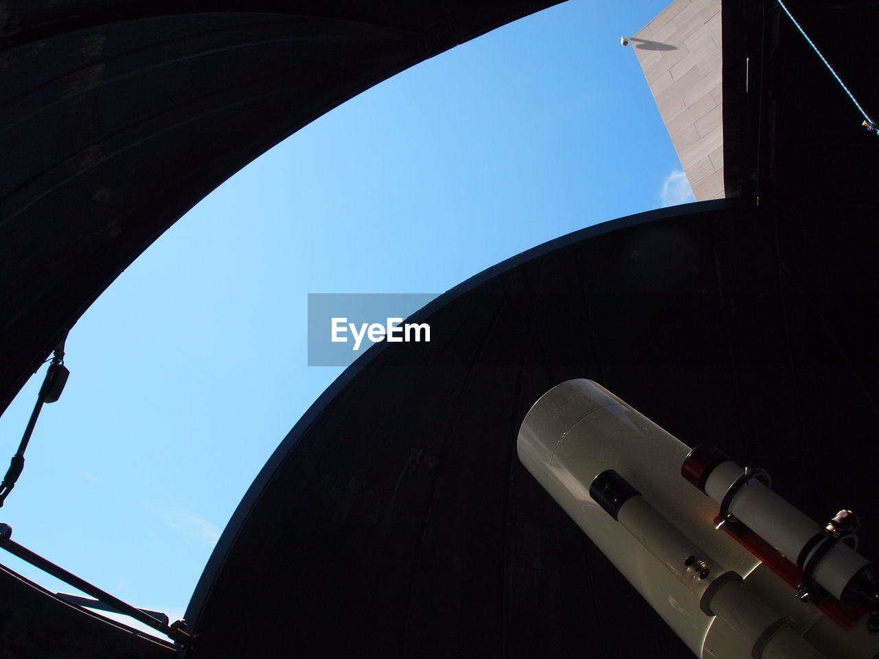 Low angle view of telescope against clear sky