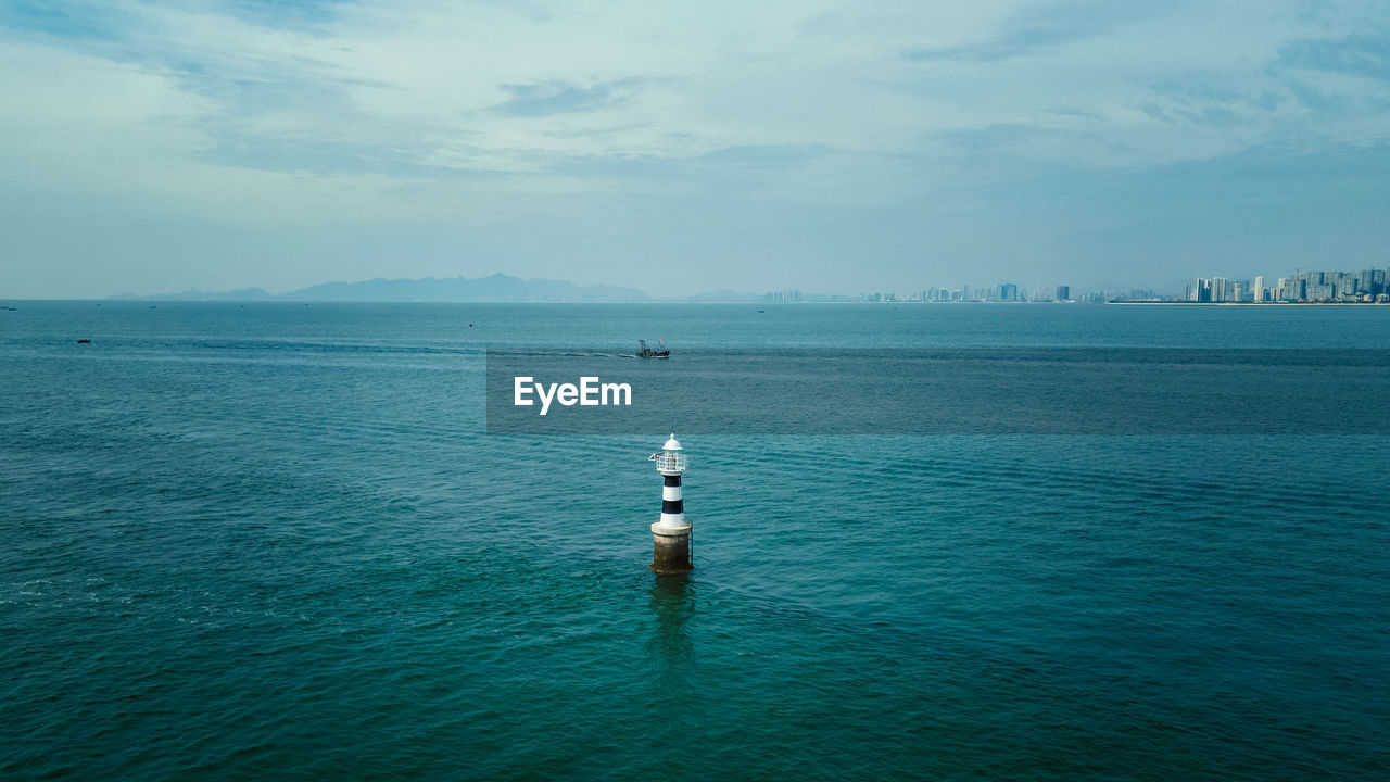 SCENIC VIEW OF SAILBOAT IN SEA AGAINST SKY