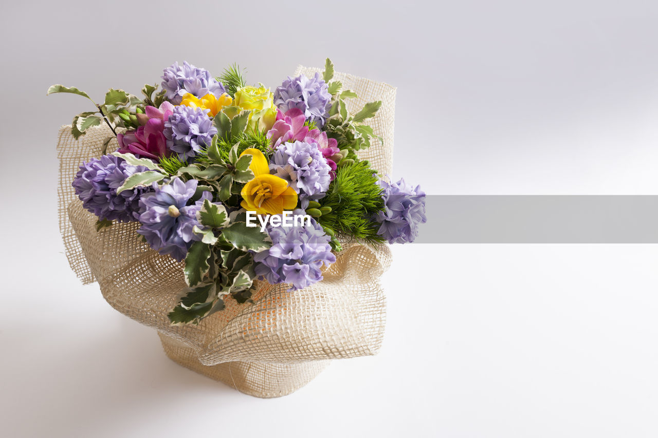 Close-up of flower bouquet against white background
