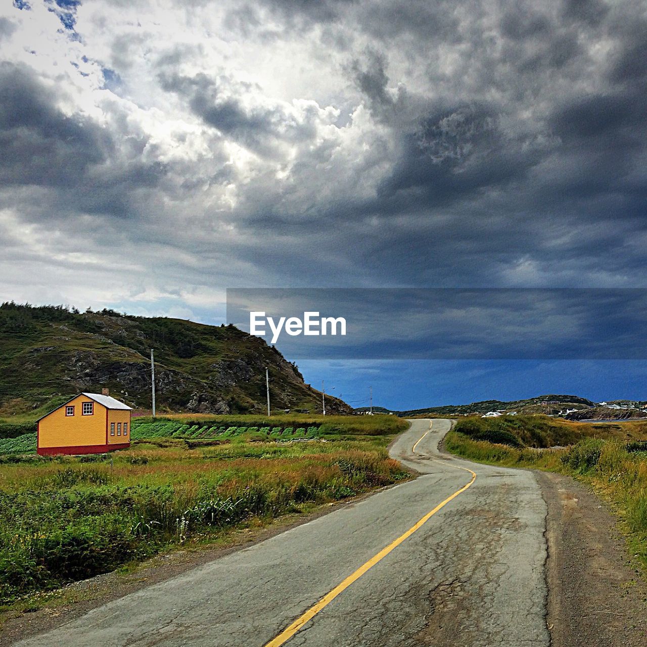 ROAD PASSING THROUGH LANDSCAPE