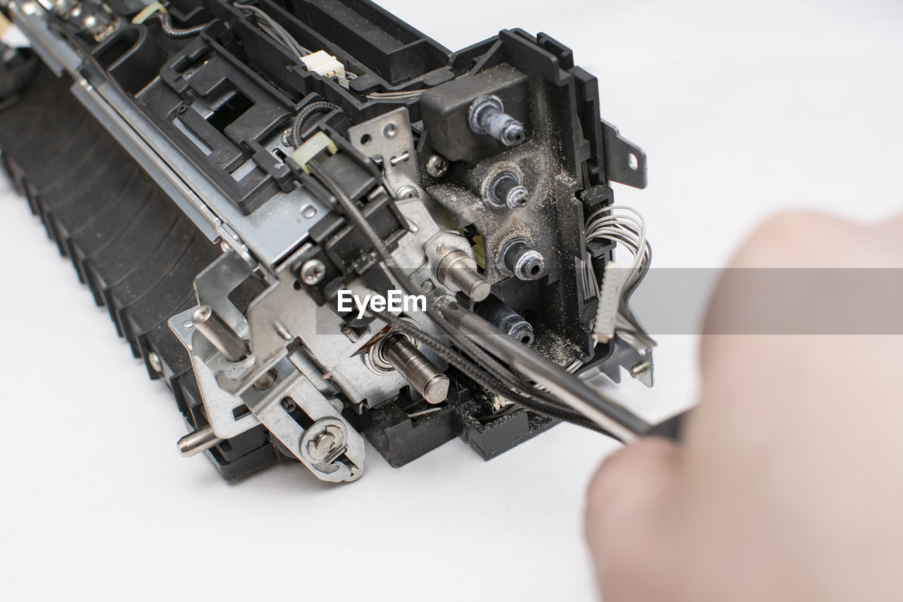 hand, technology, holding, indoors, close-up, one person, studio shot, adult, white background, occupation, camera, industry