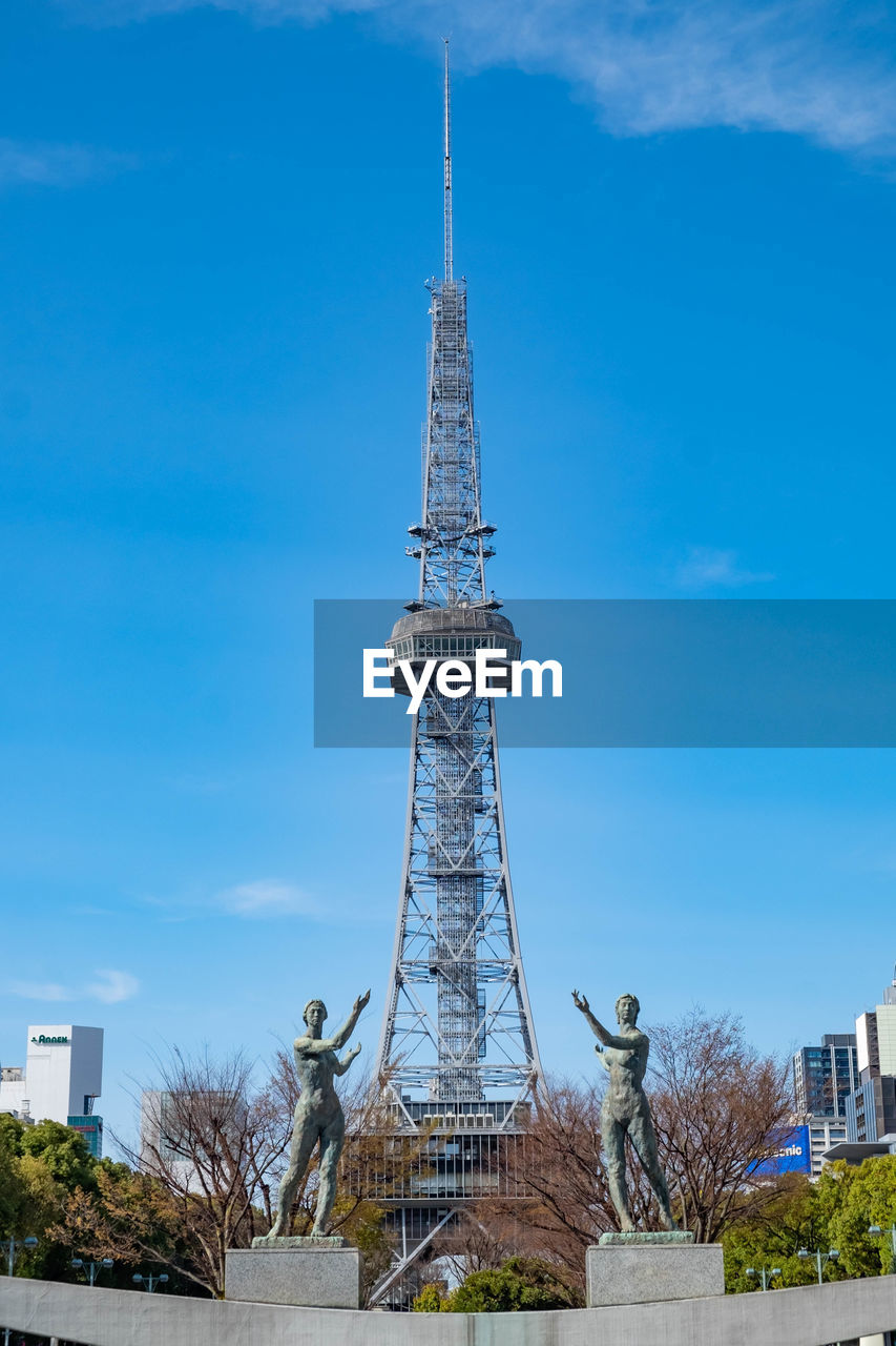 TOWER AGAINST CLOUDY SKY